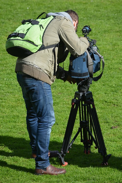 camera operator filming interview desk