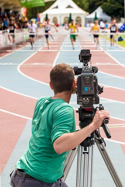 camera operator filming interview desk